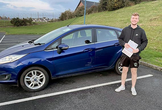 A young man passes his driving test with Hamilton School of Motoring